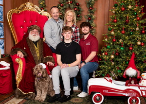 family and dog with Santa